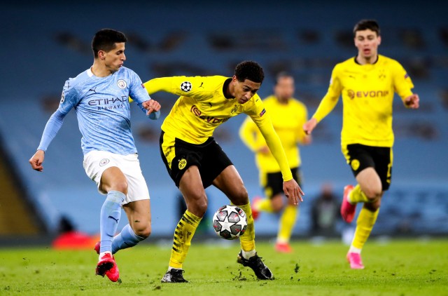 João Cancelo et Jude Bellingham lors d'un match entre Man City et le Borussia Dortmund.